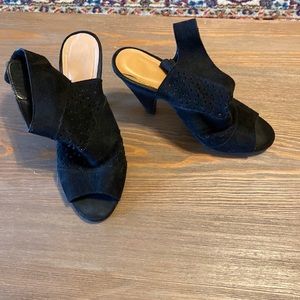 Black Velcro heels. Slight wear.